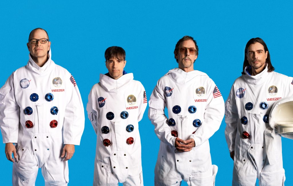 Weezer announce ‘The Gold Album’ with mournful single ‘We Might As Well Be Strangers’ featuring Wednesday’s Karly Hartzman